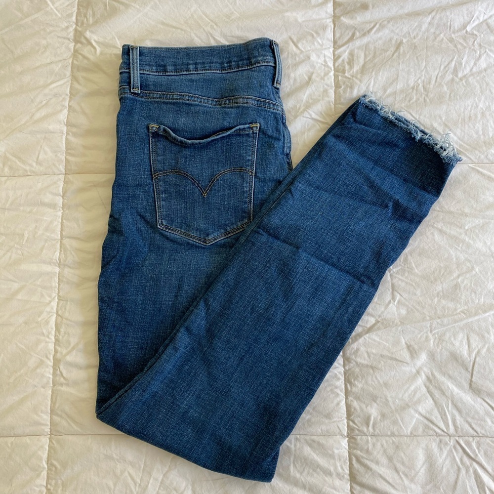 Levi’s Distressed 311 Shaping Skinny Jeans